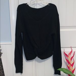 knotted black sweater